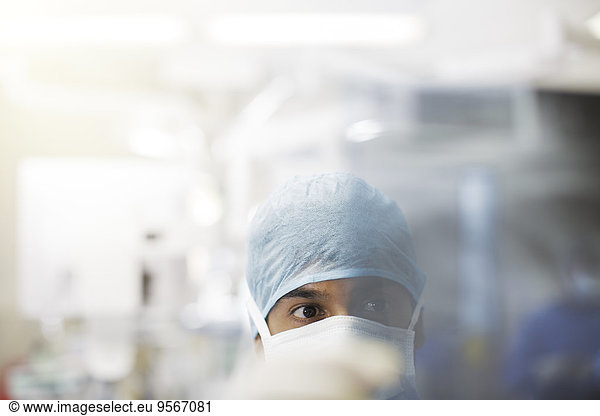 Portrait of surgeon wearing surgical cap and mask