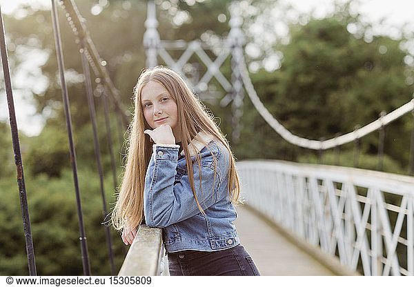Portrait of teenage girl on a bridge