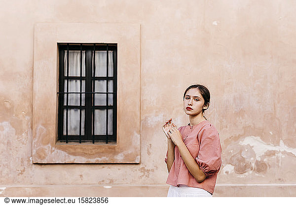 Portrait of teenage girl wearing pink blouse