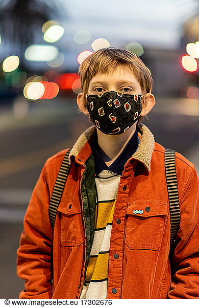 Portrait of teenager wearing mask during COVID 19 pandemic in city