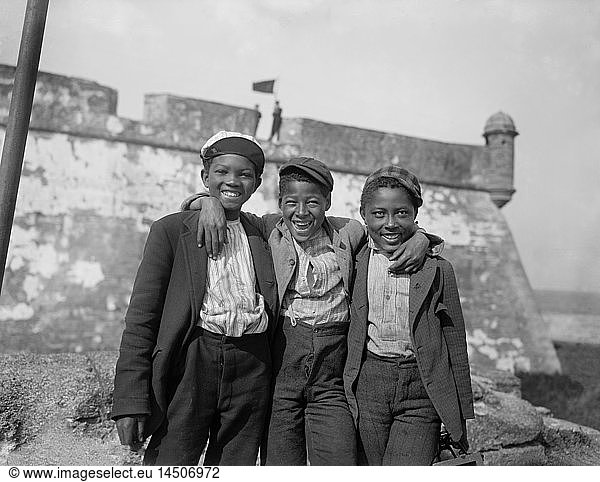 Portrait of Three Smiling Boys with Fort Matanzas in Background  ''Happy as the Day is Long''  St. Augustine  Florida  USA  William Henry Jackson for Detroit Publishing Company  1902