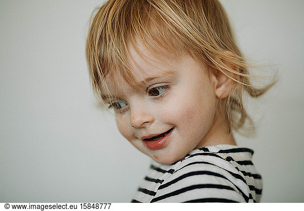 portrait of toddler against white background