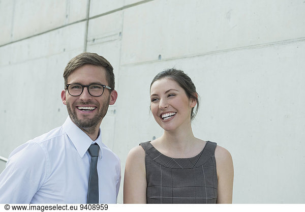 portrait of two business partners smiling