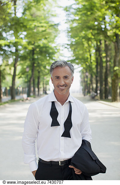 Portrait of well-dressed man in park
