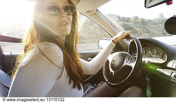 Portrait of woman driving in camper van