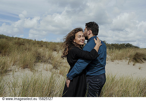 Portrait of woman hugging her husband in the dunes  The Hague  Netherlands