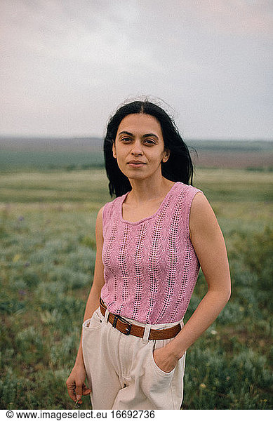 portrait of woman standing in field