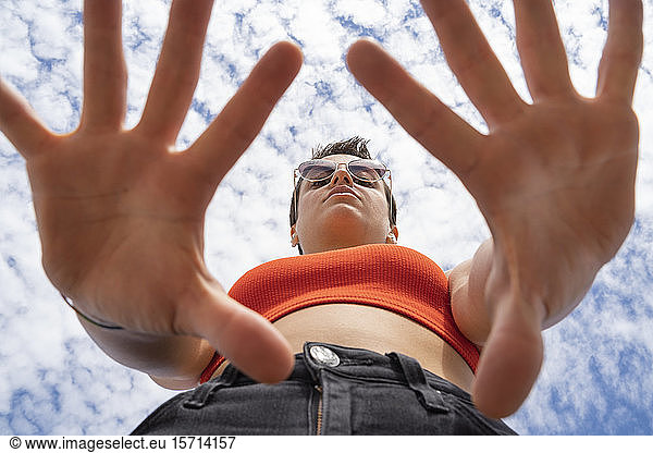 Portrait of woman with sunglasses against sky
