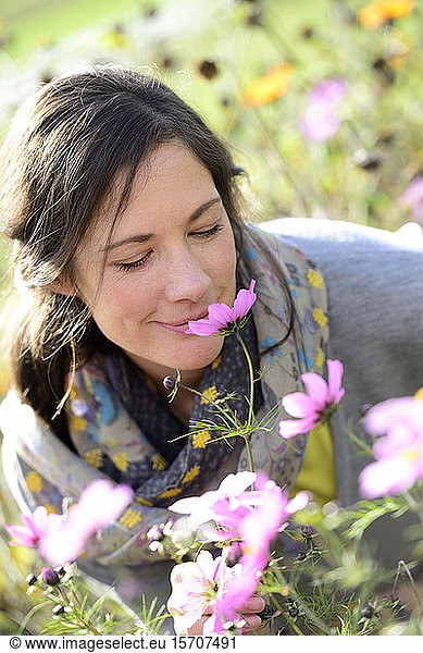 Portrait of women smelling on wild flower  flower meadow