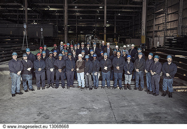 Portrait of workers in factory warehouse