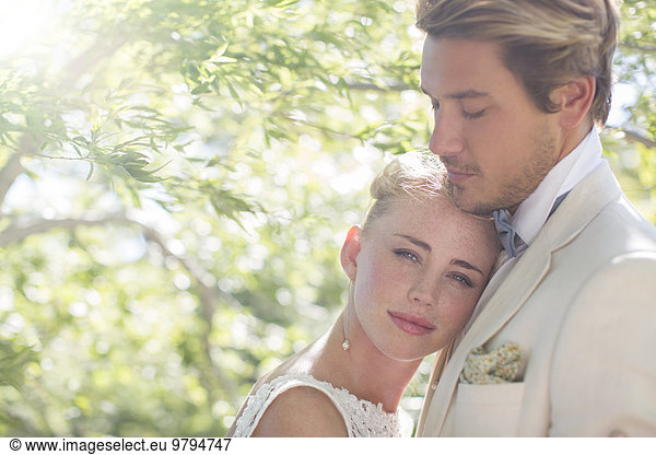 Portrait of young couple in domestic garden