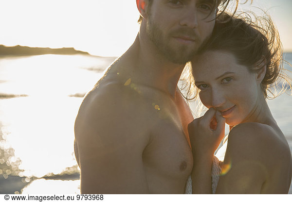 Portrait of young couple on beach