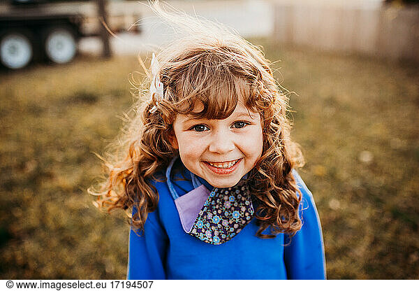 Portrait of young girl smiling wearing homemade face covering Portrait ...