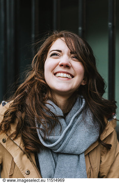 Portrait of young woman  smiling  outdoors