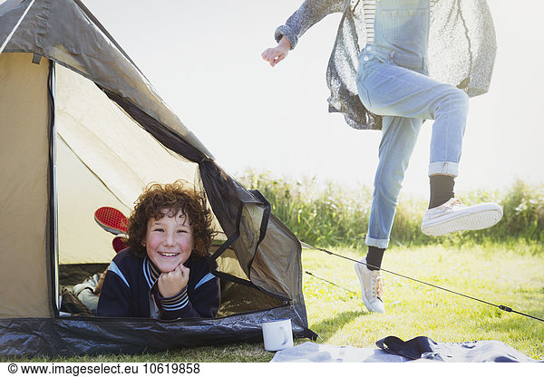 Portrait smiling boy inside tent