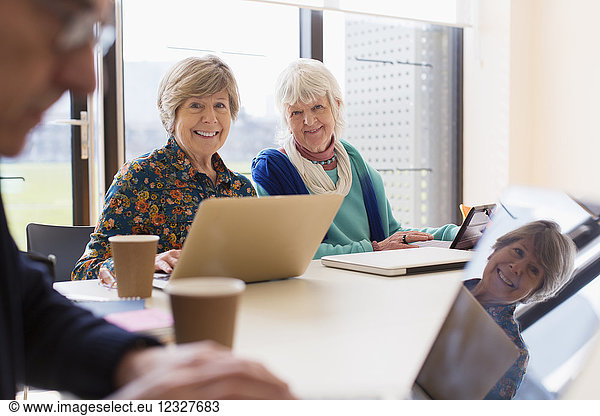 Portrait smiling  confident senior businesswomen in conference room meeting