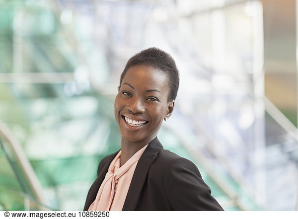 Portrait smiling corporate businesswoman