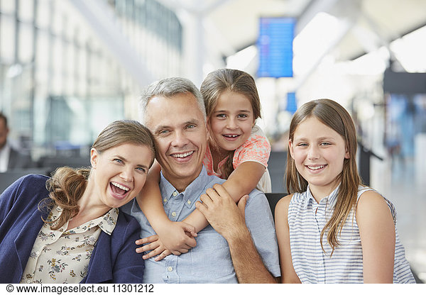 Portrait smiling family in airport departure area