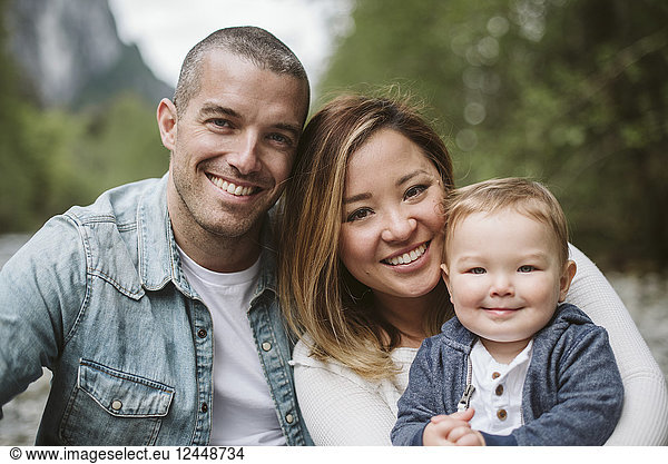 Portrait smiling parents and baby son