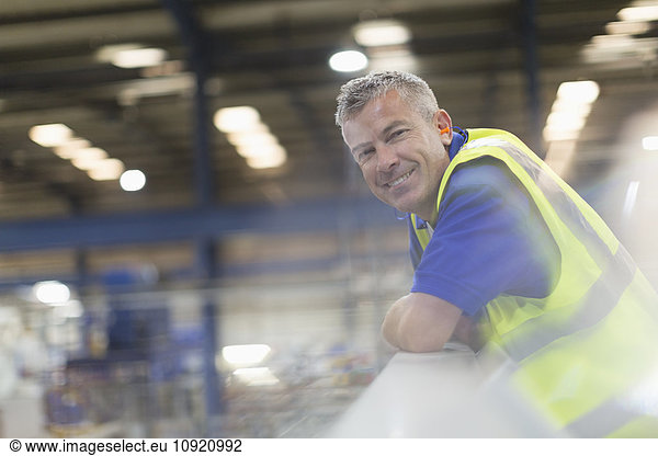 Portrait smiling supervisor in steel factory