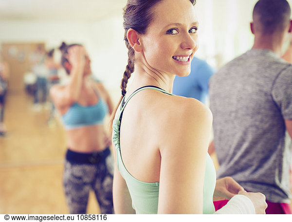 Portrait smiling woman in exercise class
