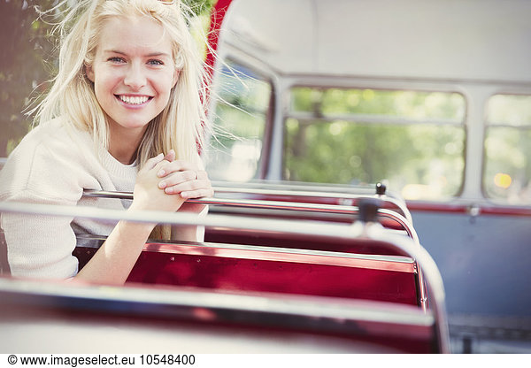 Portrait smiling woman riding double-decker bus
