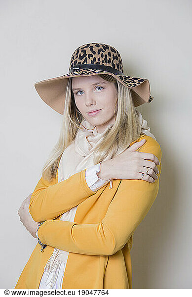 Portrait woman with yellow sack and hat
