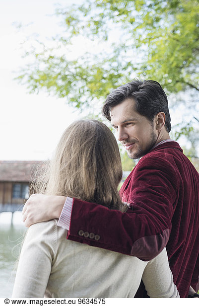 Portrait young loving couple embracing