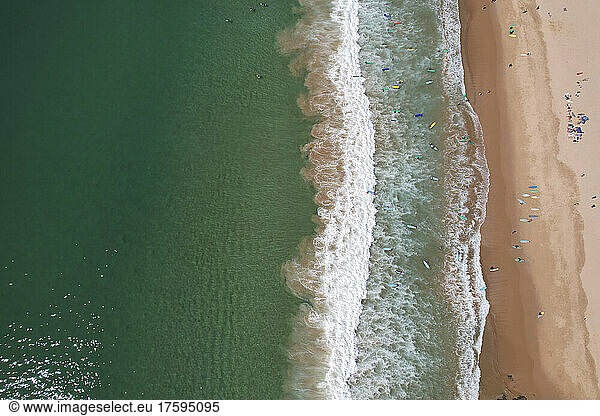 Portugal  Algarve  Vila do Bispo  Aerial view of surfers at Praia do Barranco beach