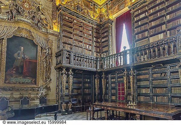 Portugal  Coimbra  historic centre  University of Coimbra  Joanina Library  Biblioteca Joanina  Baroque  bookshelsves  books  stacks  reading room  table  gild .