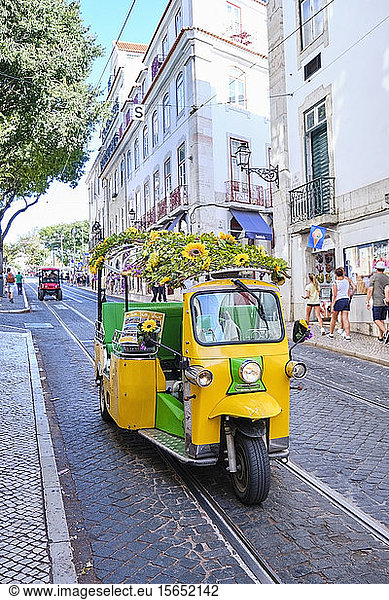 Portugal  Lisbon  Alfama  tuk tuk on city street