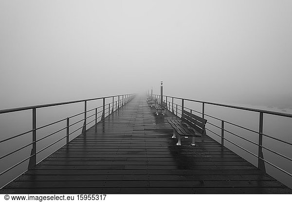Portugal  Lisbon  Tagus River walkway shrouded in thick fog