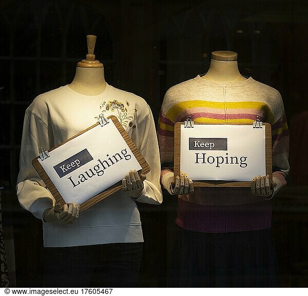 Positive messages during Covid coronavirus lockdown held by mannequins in shop window  UK  Keep Laughing  Keep Hoping