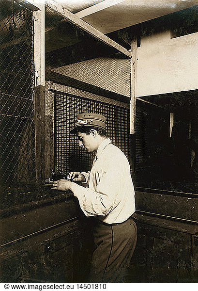Postal Telegraph Boy Learning to Send Messages during Spare Moment  New York City  New York  USA  Lewis Hine  1910