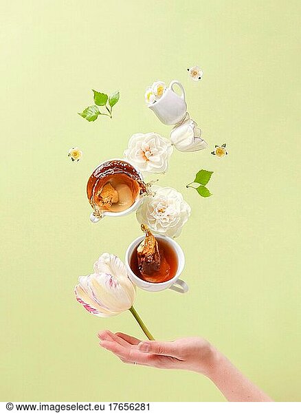 postcard for caffe flying levitation cups with tea and flowers