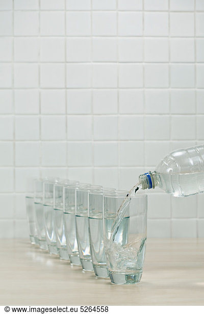 Pouring glasses of mineral water