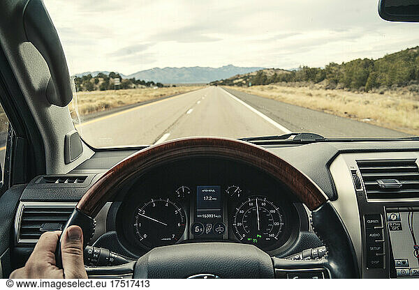POV driving luxury car on highway