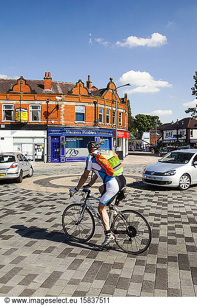Poynton village in Cheshire has recently undertaken a shared space road experiment  where pedestrians and vehicles share the same space. Such schemes in Holland are very common and lead to mo