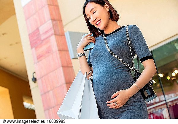 Pregnant women happy shopping