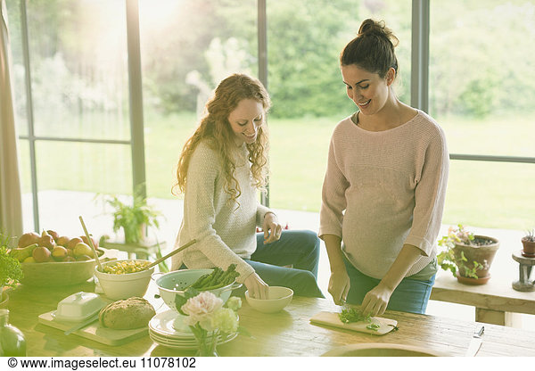 Pregnant women preparing food