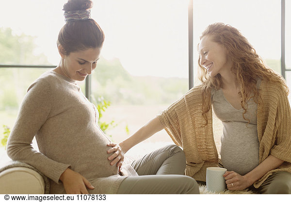 Pregnant women touching stomach