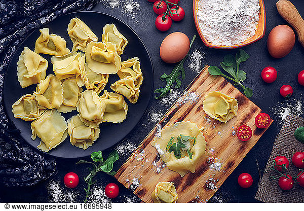 Preparation of Italian pasta with ingredients. Gastronomic concept