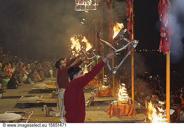 Priests celebrating the River Ganges  Aarti by offering incense  Dashashwamedh Ghat  Varanasi  Uttar Pradesh  India  Asia