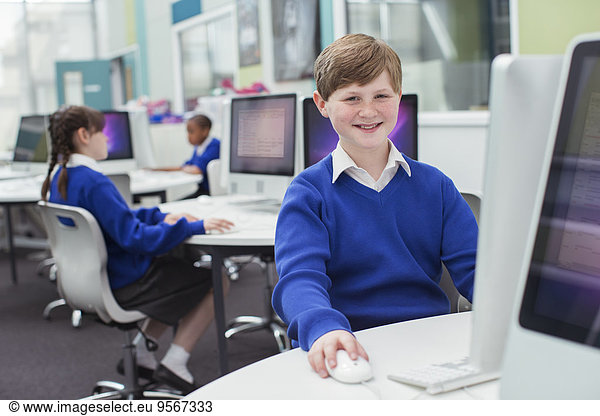 Primary school children working with computers