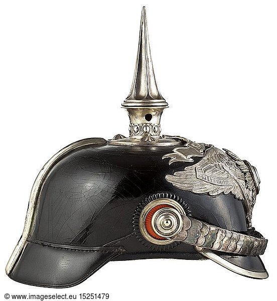 Prince Oskar of Prussia (1888 - 1958) - a helmet as officer in the 1st Foot Guard Regiment  Body made of black patent leather (brittle)  silver fittings. Eagle emblem with applied  enamelled guard star ('Suum Cuique')  surmounted by the script banner 'Semper Talis'  flat chinscales on officer's cockades  high fluted spike (unscrewable)  pearl ring  circular crown plate with star screws. White silk lining and white leather sweatband  inside the body manufacturer's label 'Ed. Schultze  KÃ¶nigl. Hoflieferant  Potsdam'. With helmet cover made of field-grey cloth. In a padded helmet case. Traces of wear and age. Prince Oskar of Prussia was the fifth child of Emperor Wilhelm II and was born in the Marble Palace in Potsdam. He graduated from the cadet school in PlÃ¶n and in 1906 took his o 20th century