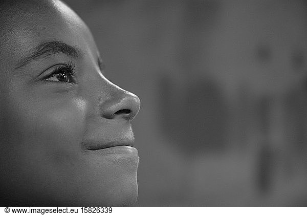 Profile of an Afro-Brazilian girl smiling