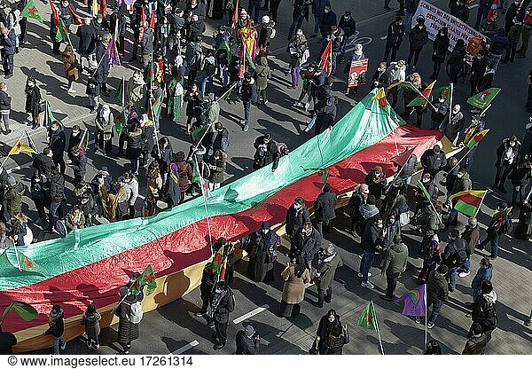 Protesters carry outstretched flag of the autonomous region of Kurdistan  demonstration for the Kurdish New Year in Düsseldorf  North Rhine-Westphalia  Germany  20 March 2021  Europe