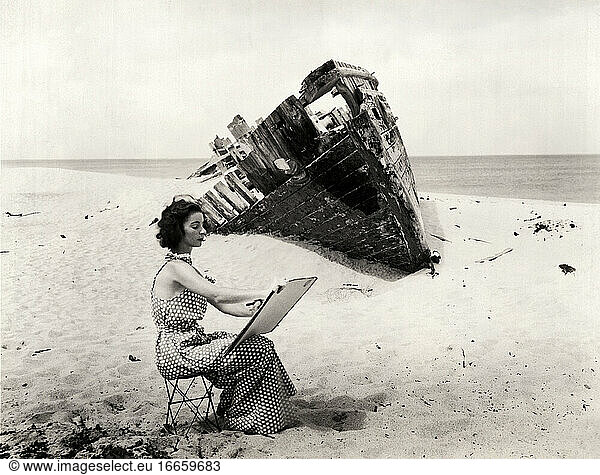 Provincetown  Massachusetts  1926.
A woman artist sketching a wreck at Race Point on Cape Cod.