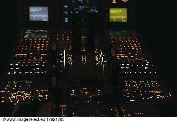 Push buttons on control panel in illuminated cockpit