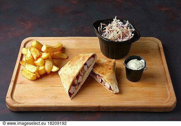 Quesadilla with fried potato  salad with white and red cabbage and garlic sauce